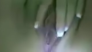Close up view of a horny masturbating her juicy pussy